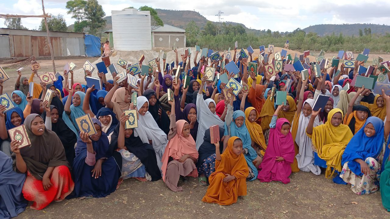 Orphans receiving Qurans
